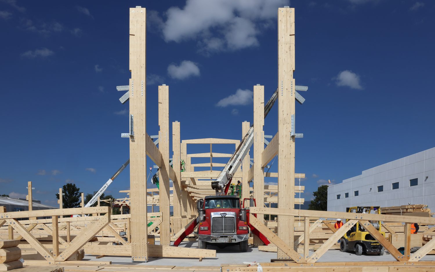 Delivery truck on site between erected glulam columns